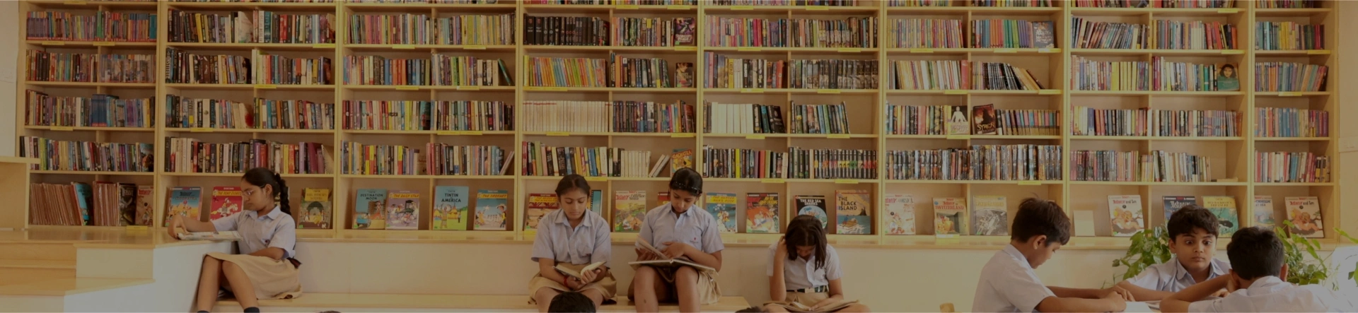 Nalanda International School students reading in the campus library